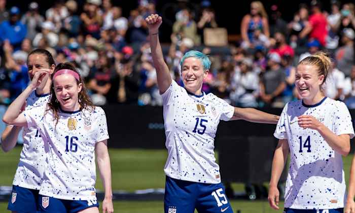 USWNT forward Megan Rapinoe celebrates with her teammates during the send-off celebrations after a game against Wales.